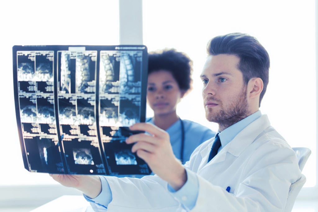 doctor and nurse looking to x ray at hospital P8B6BVT scaled