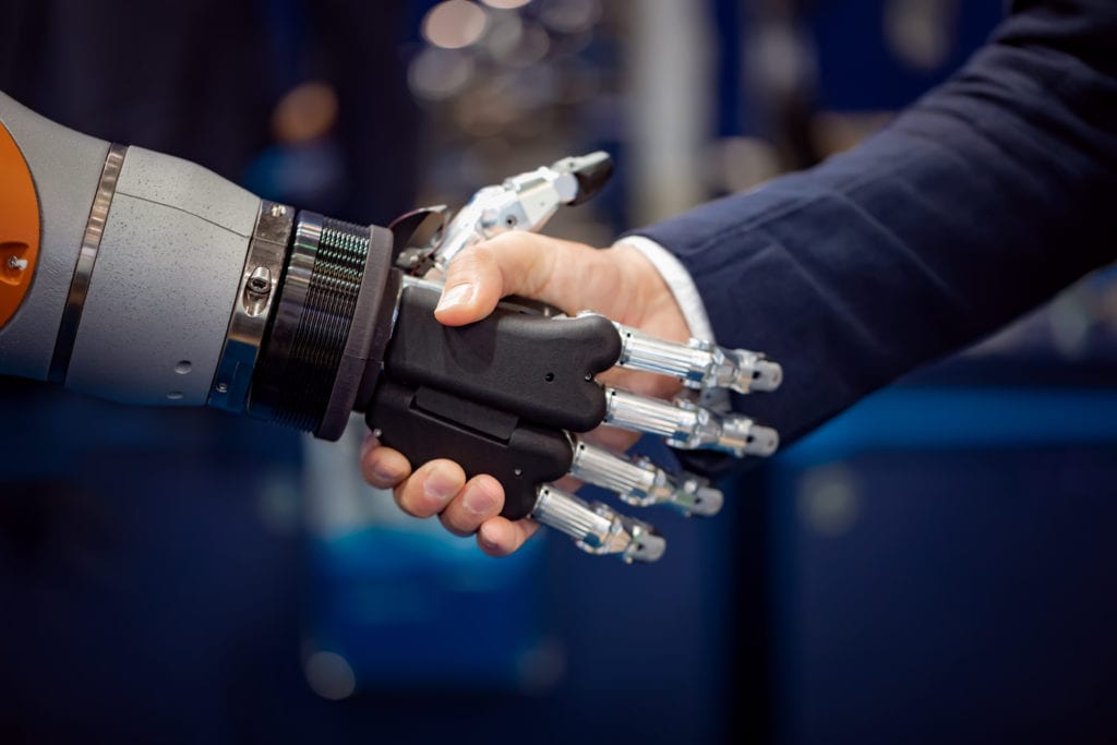 hand of a businessman shaking hands with a GYDH3MX scaled